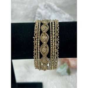 Six Piece Set of Gold Bangle Bracelets